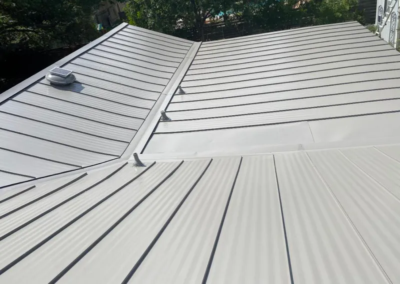 Solar attic fan installed on a metal roof for Roof Ventilation in Canby